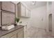 Laundry room with custom cabinetry and a large countertop at 8793 W Villa Lindo Dr, Peoria, AZ 85383