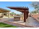 Enjoy cooking outdoors under a pergola at 8793 W Villa Lindo Dr, Peoria, AZ 85383