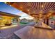 Outdoor kitchen and dining area under pergola at 8793 W Villa Lindo Dr, Peoria, AZ 85383