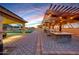 Outdoor kitchen and dining area under pergola at 8793 W Villa Lindo Dr, Peoria, AZ 85383