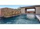 Resort-style pool with stone water features and a relaxing patio area at 8793 W Villa Lindo Dr, Peoria, AZ 85383