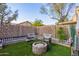 Landscaped backyard with a fire pit and seating area at 9030 S Maple Ave, Tempe, AZ 85284