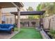 Wonderful backyard with a covered patio and artificial turf at 9030 S Maple Ave, Tempe, AZ 85284