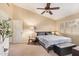 Main bedroom with ceiling fan and large windows at 9030 S Maple Ave, Tempe, AZ 85284