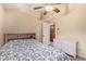 Charming bedroom with a ceiling fan and built-in shelving at 9030 S Maple Ave, Tempe, AZ 85284