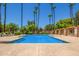 Refreshing community pool with lounge chairs and shaded seating at 9030 S Maple Ave, Tempe, AZ 85284