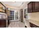 Bright kitchen with French doors leading to backyard at 9030 S Maple Ave, Tempe, AZ 85284