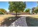 Paved pathway with mature trees alongside at 9030 S Maple Ave, Tempe, AZ 85284