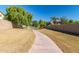 Paved walking path winds through a grassy park area at 9030 S Maple Ave, Tempe, AZ 85284