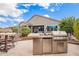 Backyard with outdoor kitchen and patio furniture at 9364 W Cashman Dr, Peoria, AZ 85383