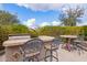 Outdoor kitchen with grill and bar-height seating at 9364 W Cashman Dr, Peoria, AZ 85383