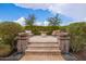 Stone patio with fire pit, creating an inviting space at 9364 W Cashman Dr, Peoria, AZ 85383