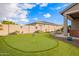 Landscaped backyard putting green, perfect for practicing your short game at 9364 W Cashman Dr, Peoria, AZ 85383