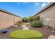 Landscaped side yard with stone pathway and lush greenery at 9364 W Cashman Dr, Peoria, AZ 85383