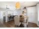 Bright dining area featuring a round table, neutral chairs, and built-in white cabinetry at 9713 E Onza Ave, Mesa, AZ 85212