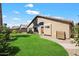 Beautiful single-story home with a well-maintained lawn, desert landscaping, and a private entry at 9713 E Onza Ave, Mesa, AZ 85212