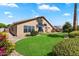 Beautiful home exterior featuring a well-manicured lawn and mature landscaping at 9713 E Onza Ave, Mesa, AZ 85212