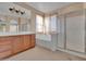 Bathroom with double vanity, soaking tub and shower at 9830 E Acacia Dr, Scottsdale, AZ 85260