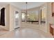 Bright breakfast nook with tile flooring and large windows at 9830 E Acacia Dr, Scottsdale, AZ 85260