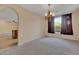 Bright dining room with chandelier and large windows at 9830 E Acacia Dr, Scottsdale, AZ 85260