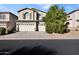 Two-story house with three-car garage and mature trees at 9830 E Acacia Dr, Scottsdale, AZ 85260