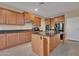 Spacious kitchen with island, granite countertops, and stainless steel appliances at 9830 E Acacia Dr, Scottsdale, AZ 85260