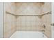 Clean bathroom with tan tile and built-in shelves at 9990 N Scottsdale Rd # 1048, Paradise Valley, AZ 85253