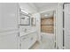 Updated bathroom with white vanity, tiled shower, and bathtub at 9990 N Scottsdale Rd # 1048, Paradise Valley, AZ 85253