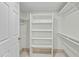 Spacious walk-in closet with shelving and hanging rods at 9990 N Scottsdale Rd # 1048, Paradise Valley, AZ 85253