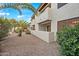 Ground level patio with desert landscaping and building exterior view at 9990 N Scottsdale Rd # 1048, Paradise Valley, AZ 85253