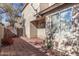Small back patio with block wall and flowering bush at 106 N 66Th Ave, Phoenix, AZ 85043