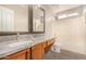 Bathroom with double vanity, granite countertops and bathtub at 106 N 66Th Ave, Phoenix, AZ 85043