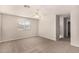 Spacious bedroom with ceiling fan and large window, offering ample natural light at 106 N 66Th Ave, Phoenix, AZ 85043