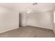 Simple bedroom with neutral wall and carpet. Offers a ceiling fan and window at 106 N 66Th Ave, Phoenix, AZ 85043