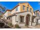 Two-story house with red door and neutral exterior at 106 N 66Th Ave, Phoenix, AZ 85043