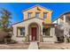 Two-story house with red door and neutral exterior at 106 N 66Th Ave, Phoenix, AZ 85043