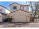 Two-story house with attached garage and brick driveway at 106 N 66Th Ave, Phoenix, AZ 85043