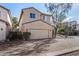 Two-story house with attached garage and brick driveway at 106 N 66Th Ave, Phoenix, AZ 85043