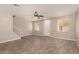 Spacious living room with wood-look floors and ceiling fan at 106 N 66Th Ave, Phoenix, AZ 85043