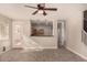 Open living room with kitchen view, wood-look floors at 106 N 66Th Ave, Phoenix, AZ 85043