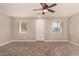 Living room with wood-look floors and ceiling fan at 106 N 66Th Ave, Phoenix, AZ 85043