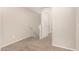 Upstairs hallway with carpeted floor and access to other rooms at 106 N 66Th Ave, Phoenix, AZ 85043