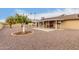 Sun-drenched backyard, covered patio, and gravel landscaping at 10906 W Tropicana Cir, Sun City, AZ 85351