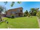 Expansive backyard featuring a grassy lawn and a view of the home's exterior at 1116 W Courtney Ln, Tempe, AZ 85284