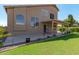 Spacious backyard with covered patio, grassy area, and mature landscaping at 1116 W Courtney Ln, Tempe, AZ 85284