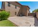 Backyard with concrete patio, grassy area, and a side view of the house at 1116 W Courtney Ln, Tempe, AZ 85284