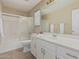 Clean bathroom with single vanity, tub, and shower at 1116 W Courtney Ln, Tempe, AZ 85284
