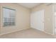 Cozy bedroom with a window and a double door closet at 1116 W Courtney Ln, Tempe, AZ 85284