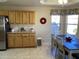 Bright kitchen featuring wood cabinets and a breakfast nook at 11440 E Milagro Ave, Mesa, AZ 85209