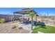 Backyard gazebo with outdoor dining set and a gravel border at 11990 E Pivot Peak --, Gold Canyon, AZ 85118